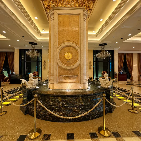 Grand marble lobby with central fountain column